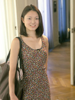 asian girl from next door has a very real moment as she poses in partial undress.