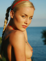 silky blonde with pigtails and a toned body on vacation.