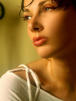 wet olya shares her large breasts and puffy nipples in this indoor shoot.