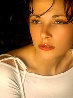 wet olya shares her large breasts and puffy nipples in this indoor shoot.