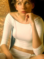 wet olya shares her large breasts and puffy nipples in this indoor shoot.