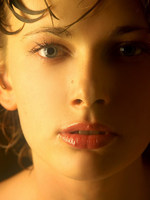 wet olya shares her large breasts and puffy nipples in this indoor shoot.