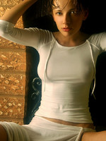 wet olya shares her large breasts and puffy nipples in this indoor shoot.