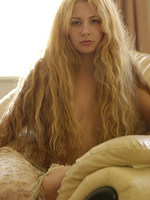 angelic set or pretty young model with extremely long blonde hair.