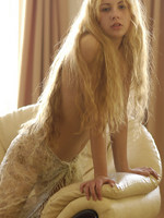 angelic set or pretty young model with extremely long blonde hair.