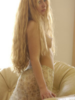 angelic set or pretty young model with extremely long blonde hair.