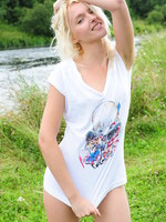 blonde cutie on the river bank.