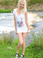 blonde cutie on the river bank.