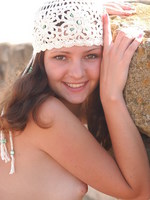 vika poses in a fishnet dress.